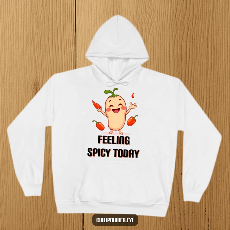 Funny hoodie with a smiling chili powder character enthusiastically juggling three tiny red peppers, a cozy and comical design.
